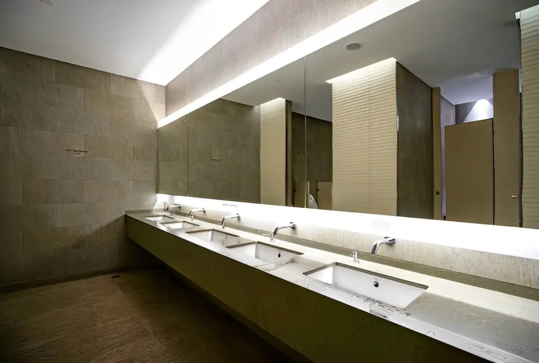 A bathroom with multiple sinks and mirrors.